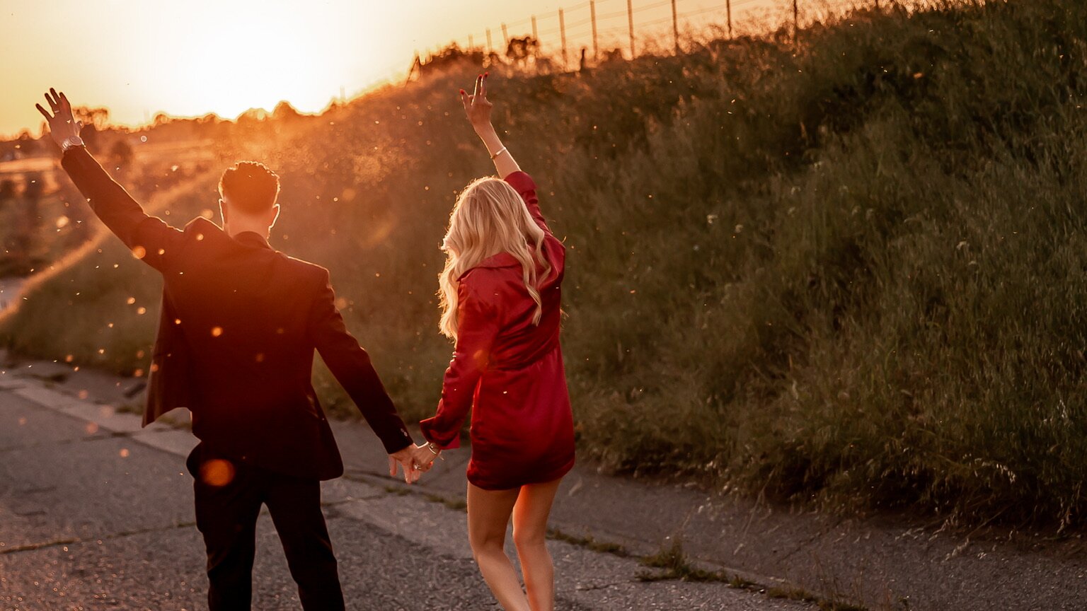 Mark and Bree walking hand in hand into a golden sunset